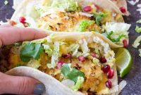 Crispy Fish Tacos with Pomegranate, Pear & Honey-Lime Crema