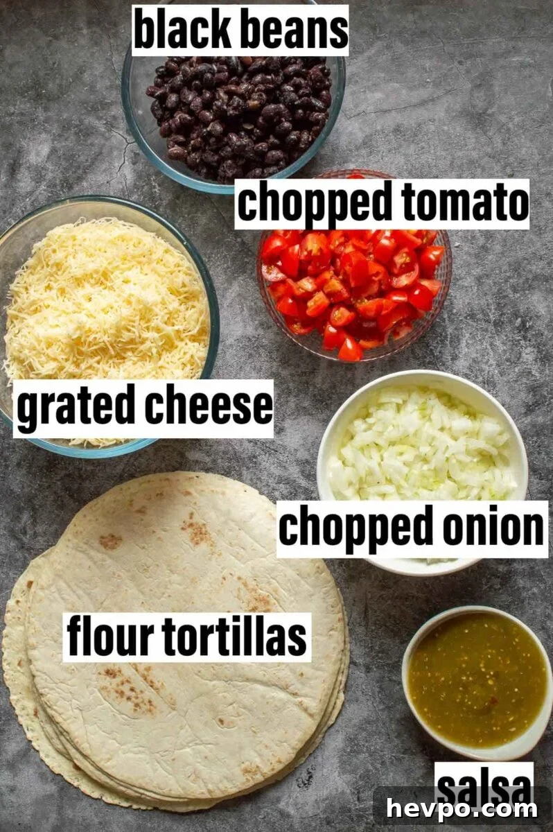 How to Style a Show-Stopping Quesadilla Platter for Entertaining 6 Labelled quesadilla ingredients including black beans, cheese, salsa and onions.