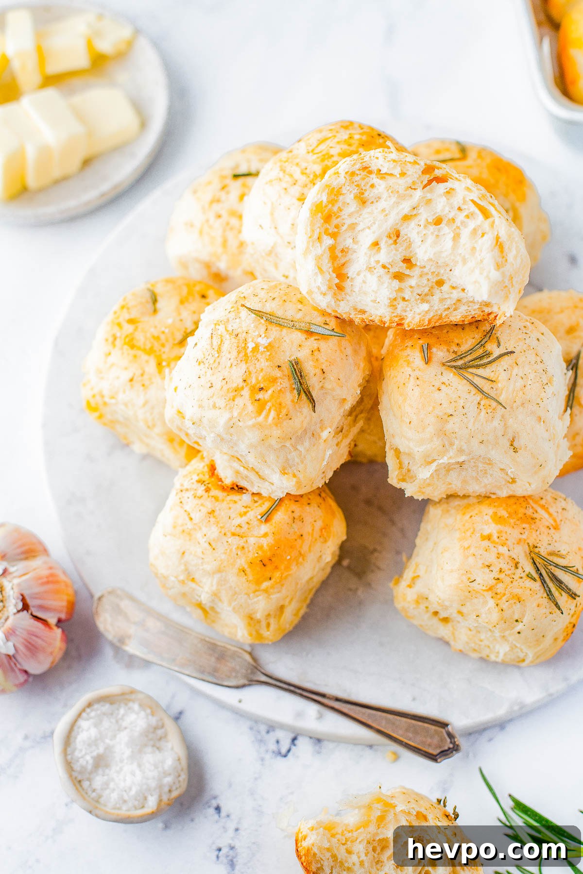 Garlic Herb Rolls on a marble platter. 