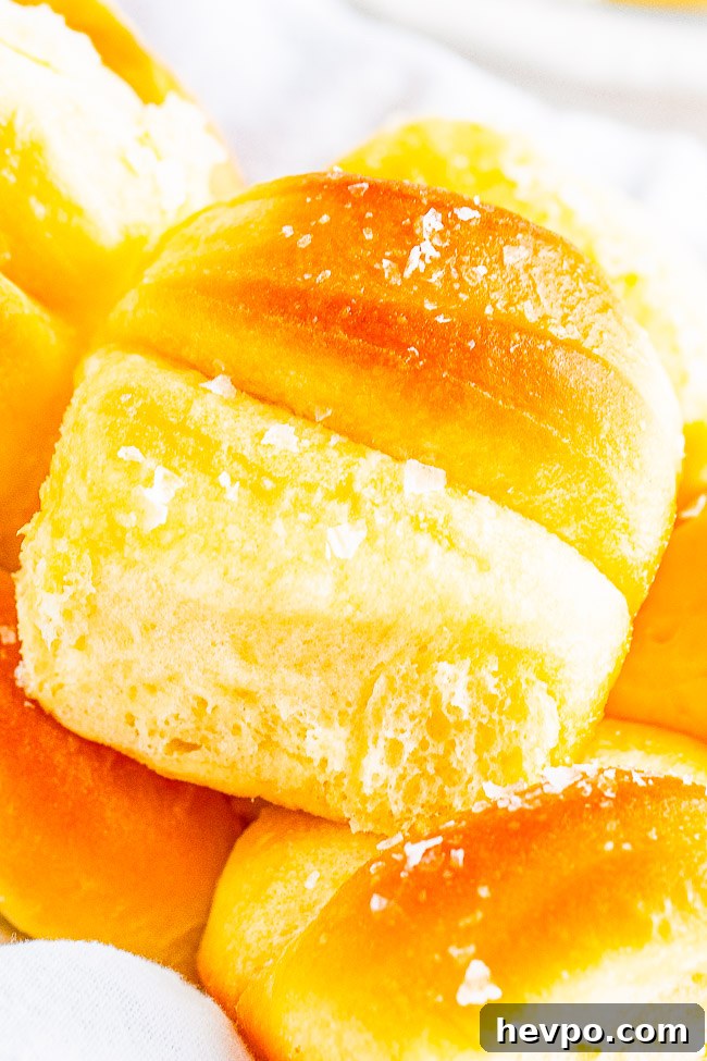 A stack of homemade Parker House rolls. 
