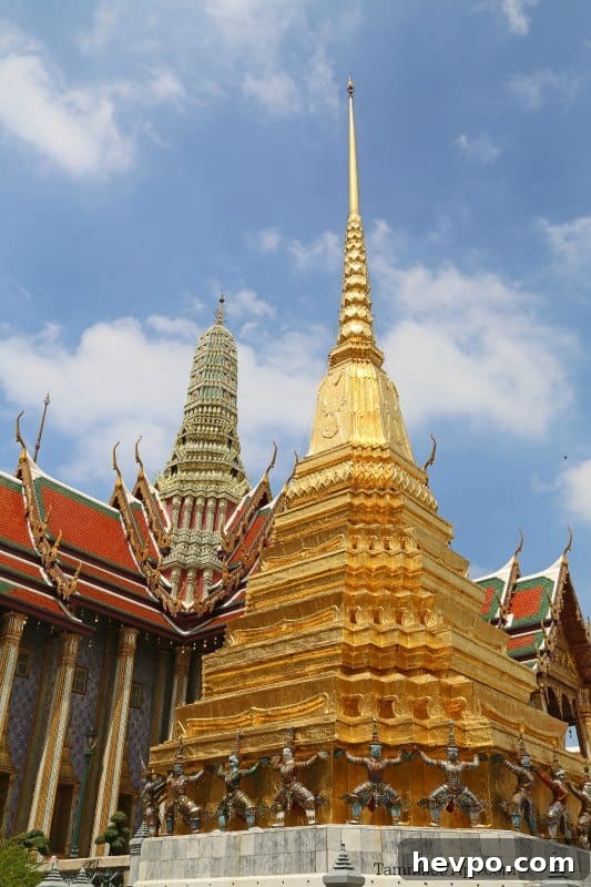 Golden tome and building in the Grand Palace complex