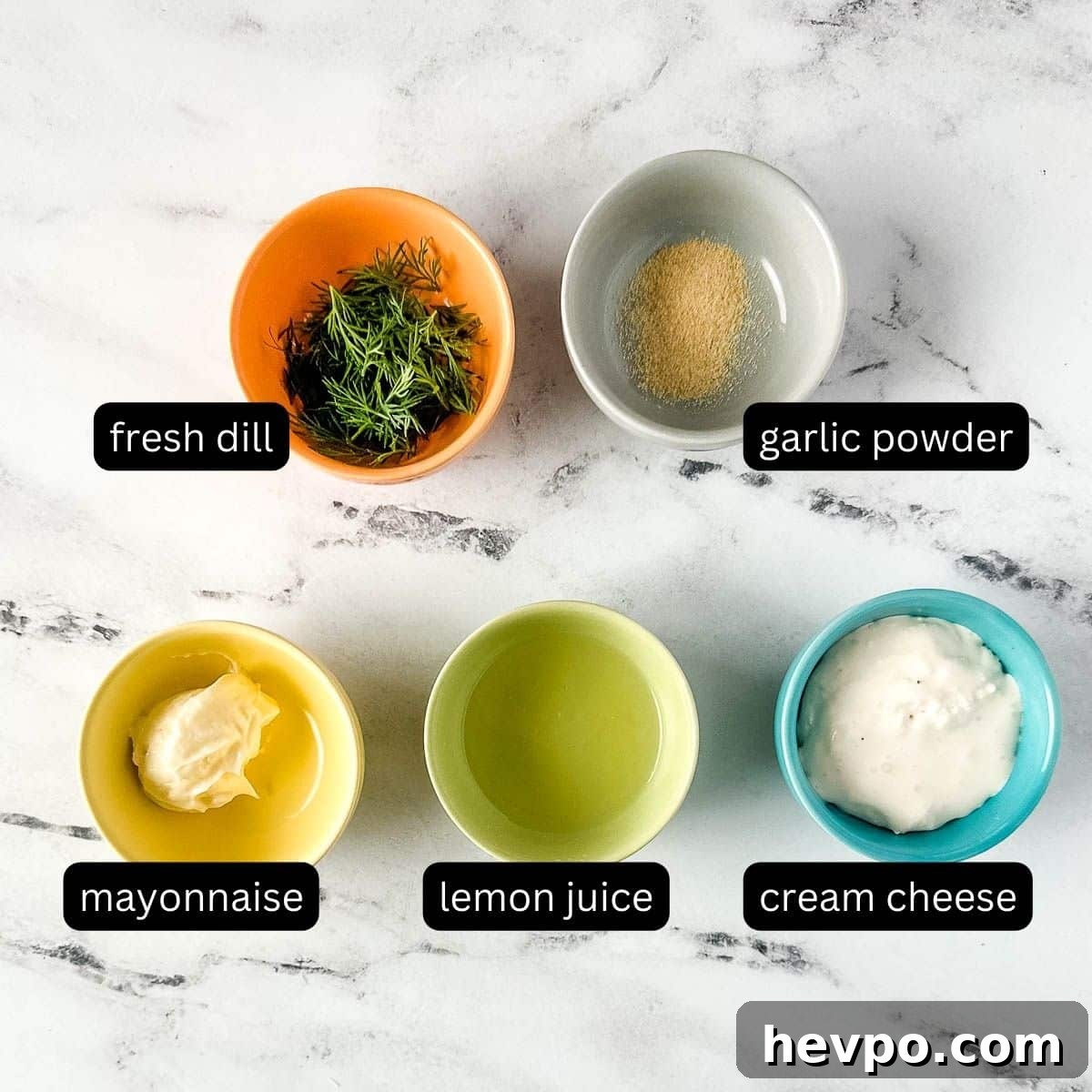 Creamy Dill Sauce for Fish, Salmon, and Vegetables 3 labeled ingredients for dill sauce on a white marble counter.