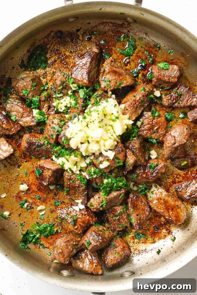 Garlic and Herb Steak Bites: Quick Savory Skillet Recipe 5 A frying pan full of Garlic Herb Steak Bites.