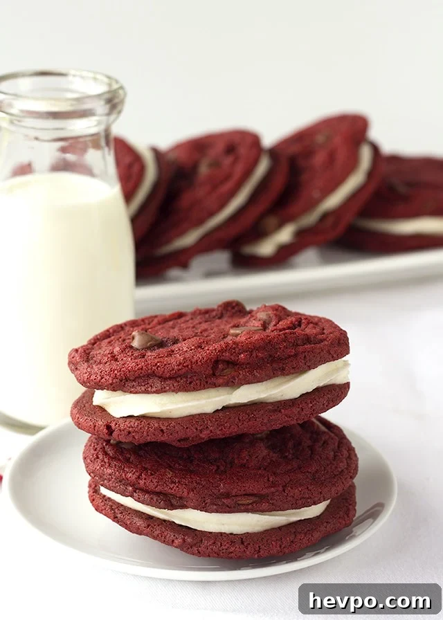 Red Velvet Sandwich Cookies Recipe: Cream Cheese Filling Guide 3 Red Velvet Sandwich Cookies - Chewy red velvet chocolate chip cookies stuffed with a fluffy cream cheese frosting.