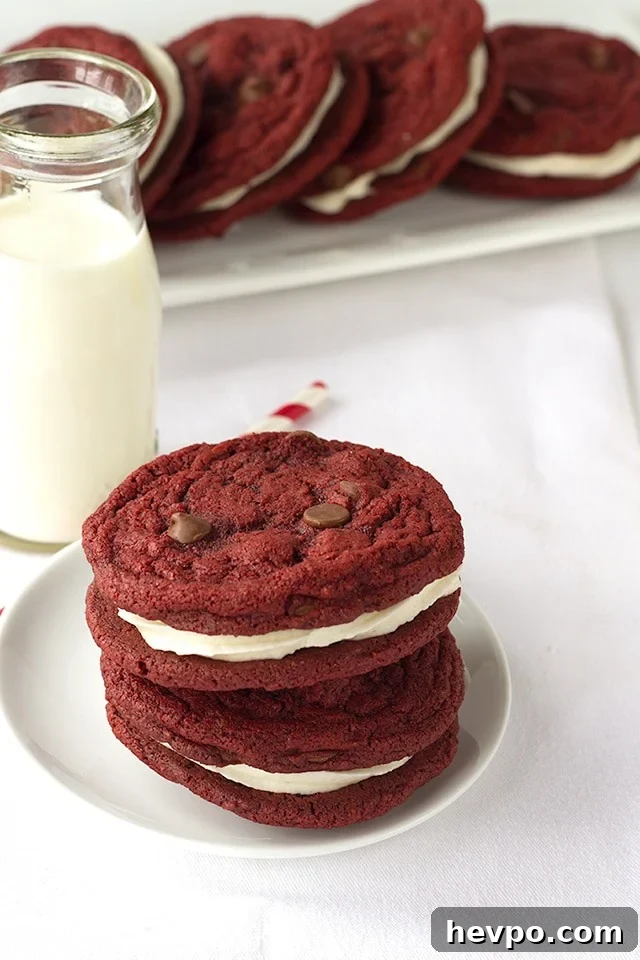 Red Velvet Sandwich Cookies Recipe: Cream Cheese Filling Guide 4 Red Velvet Sandwich Cookies - Chewy red velvet chocolate chip cookies stuffed with a fluffy cream cheese frosting.