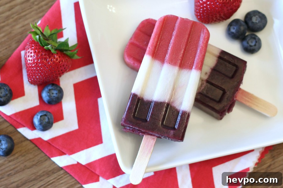 Dairy Free Berry Creamy Popsicles. Made with fresh fruit and coconut milk, these patriotic pops couldn't be easier!