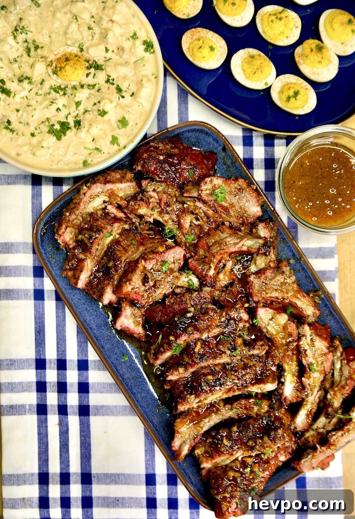 Platter of ribs, potato salad, deviled eggs.