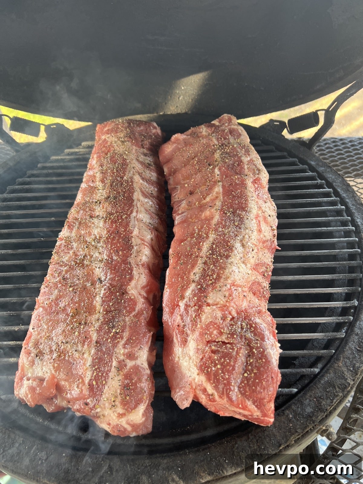 2 racks ribs on a grill.