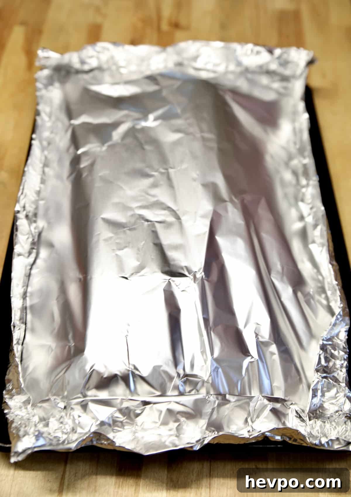 Foil packet of baby back ribs.