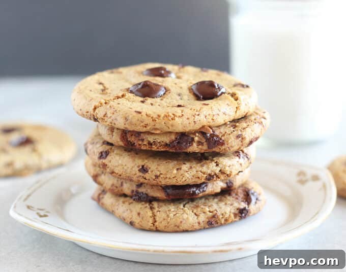 Healing My Interstitial Cystitis With Natural Therapies 3 Chocolate chip cookies stacked on a white plate.