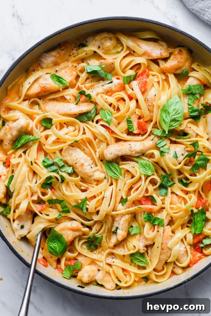 top down view of creamy tomato basil pasta in a skillet