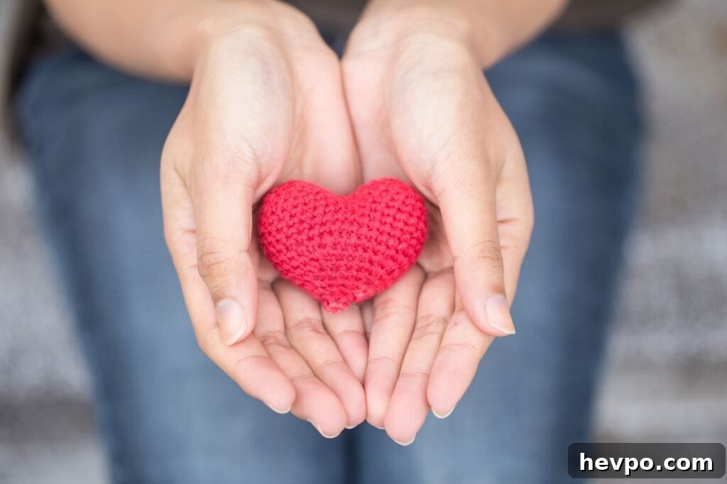 woman holding crocheted heart in hands as a free gift metaphor