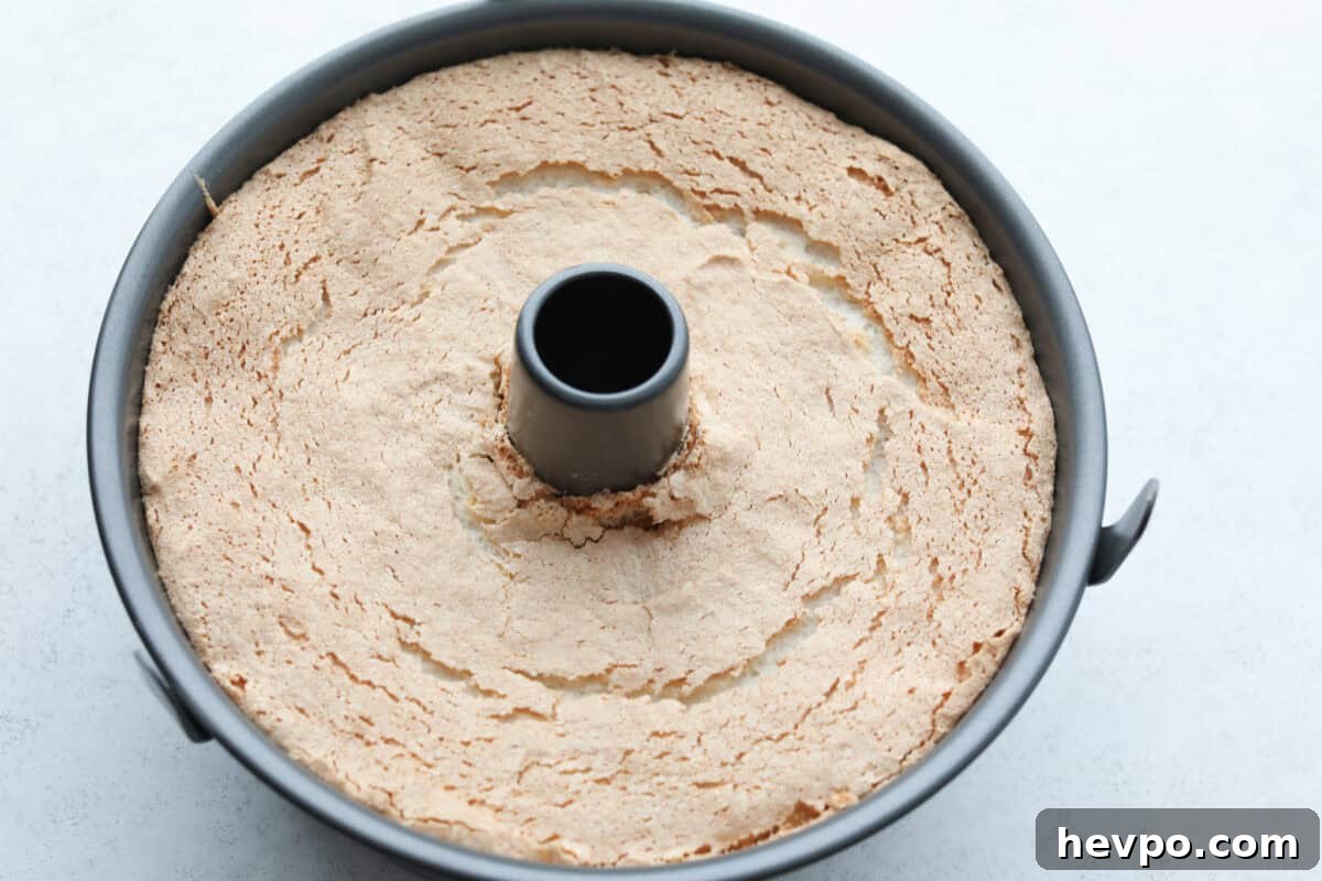 Bake for 35 minutes at 375 degrees Fahrenheit. Overhead shot of bakes angel food cake in tube pan.
