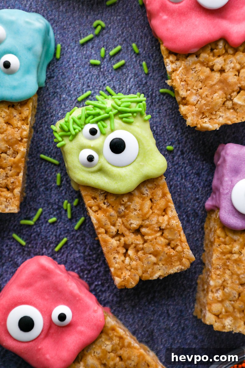 Spooky Halloween Rice Krispie Treats for Kids and Parties 5 A healthier peanut butter rice krispie treat decorated in green colored white chocolate with candy eyes and green sprinkles