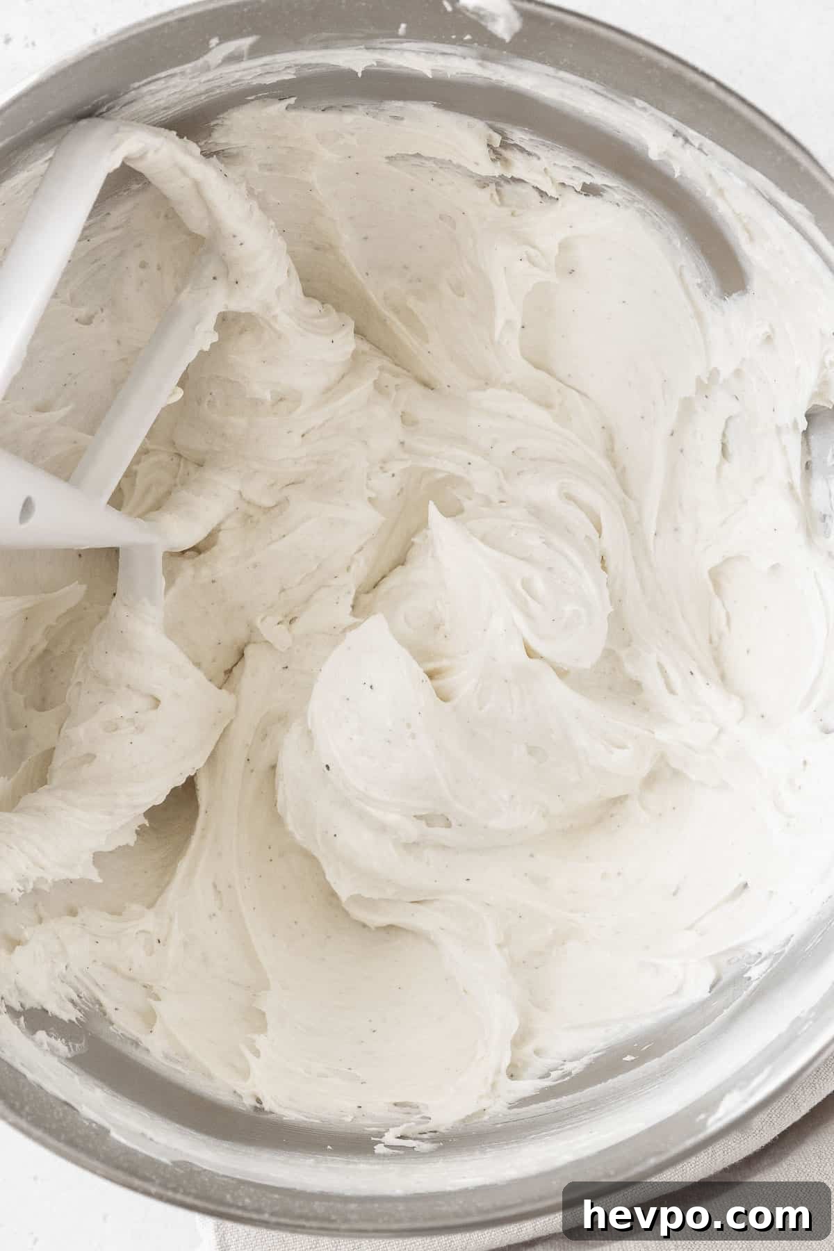 An overhead shot of a mixing bowl of the dairy free buttercream.