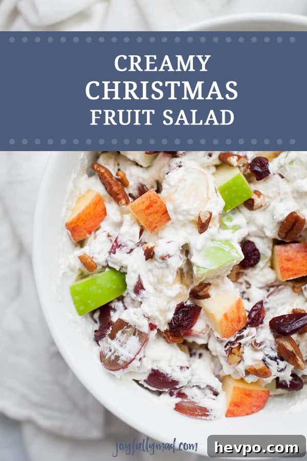 Creamy Christmas Fruit Salad is the perfect side dish for your holiday dinner! Your family will love this winter fruit salad with heavy whipping cream, apples, cranberries, grapes, bananas and pecans.