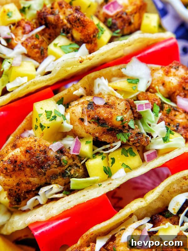 Authentic Vegetarian Mexican Rice Recipe — Flavorful & Simple 16 three air fryer shrimp tacos in a red taco stand.