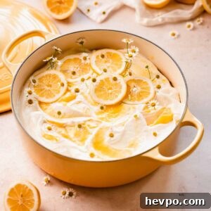 Moist Lemon Poke Cake Recipe with Zesty Lemon Glaze 24 decorated lemon poke cake in a dutch oven