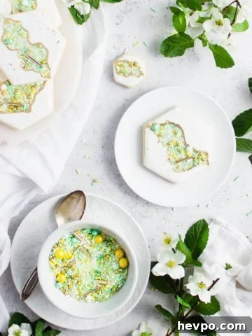 plated cookie next to a bowl of sprinkles surround by flowers