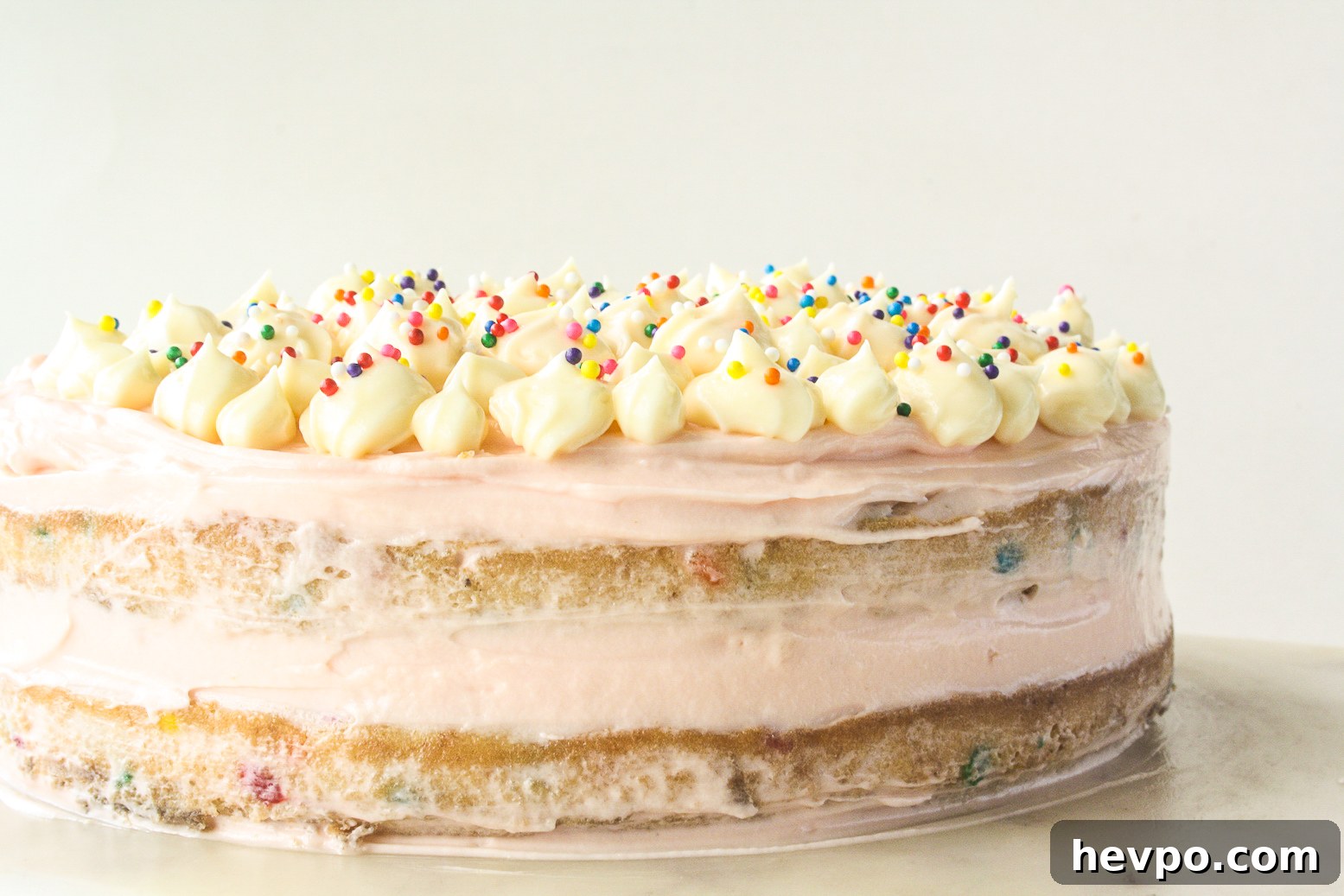 Funfetti Birthday Cake with Cream Cheese Frosting 2 Buttery layer cake with sprinkles and pink frosting!