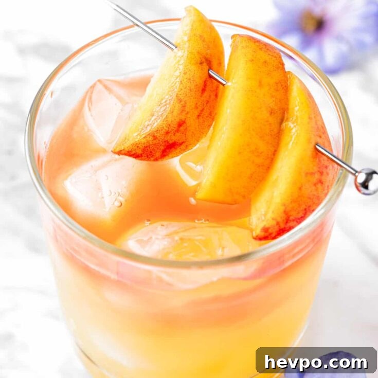 Overhead view of a georgia peach drink garnished with peach slices.