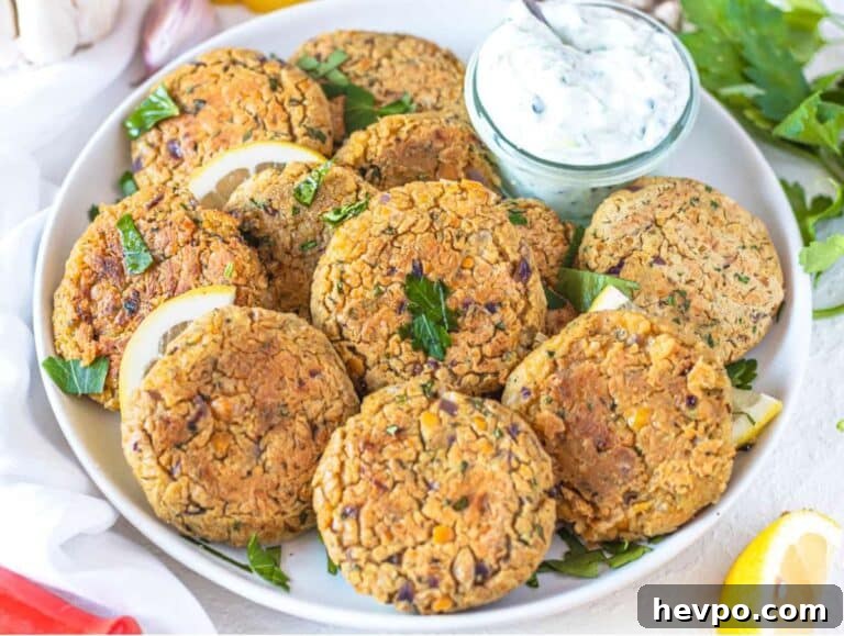 Step 4 Serving chickpea patties on platter with lemon parsley and dipping sauce.