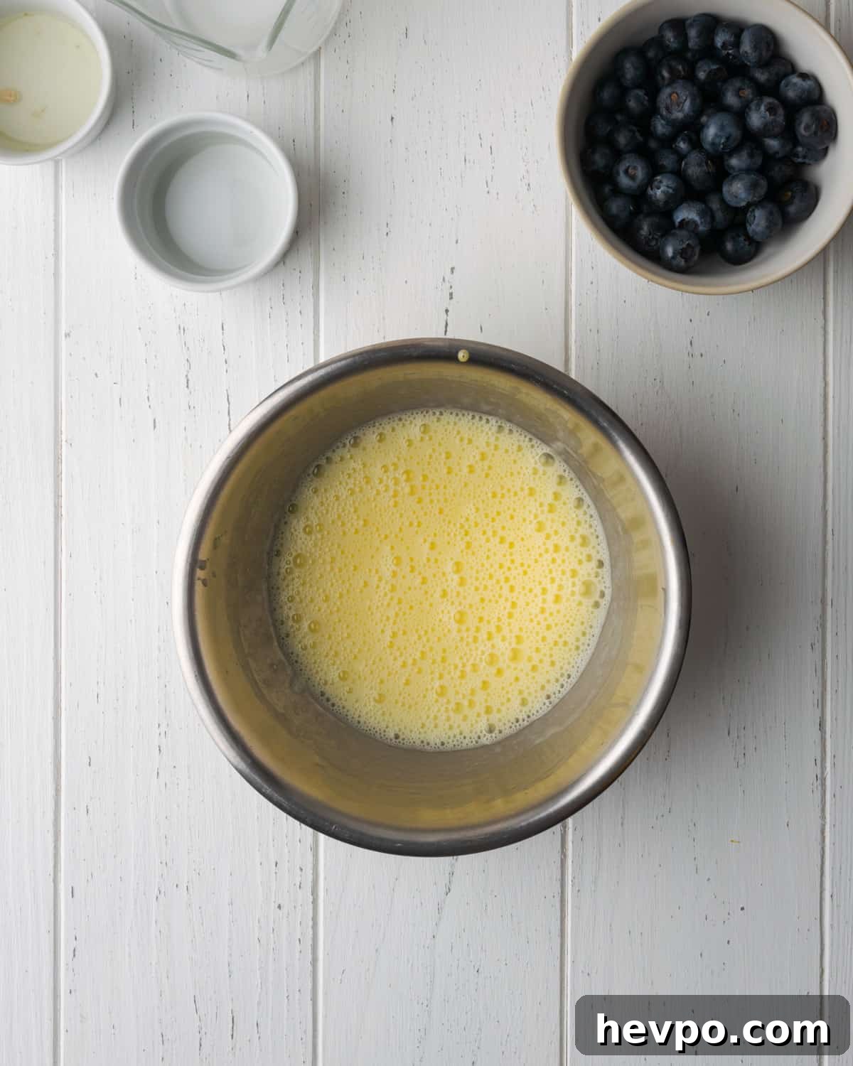Gluten-Free Lemon Blueberry Muffins Recipe (Moist & Zesty) 6 Wet ingredients added to the beaten egg and whisked together in the small bowl.