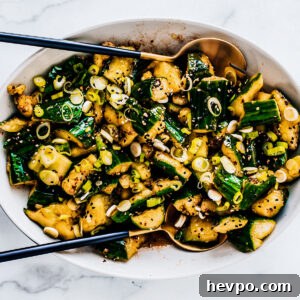 Smashed cucumber salad in serving bowl.