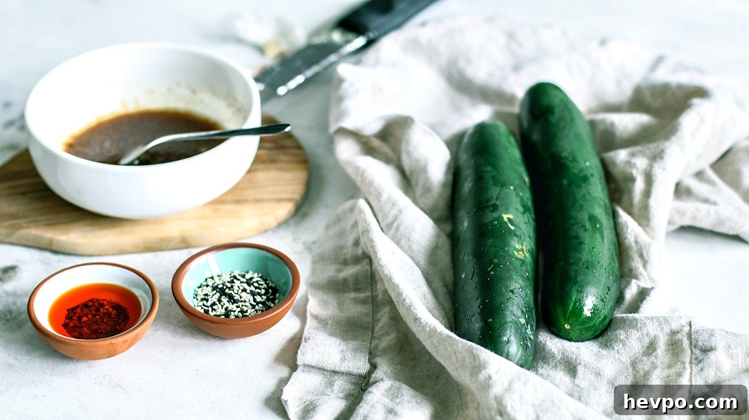 Cucumbers and ingredients on table.