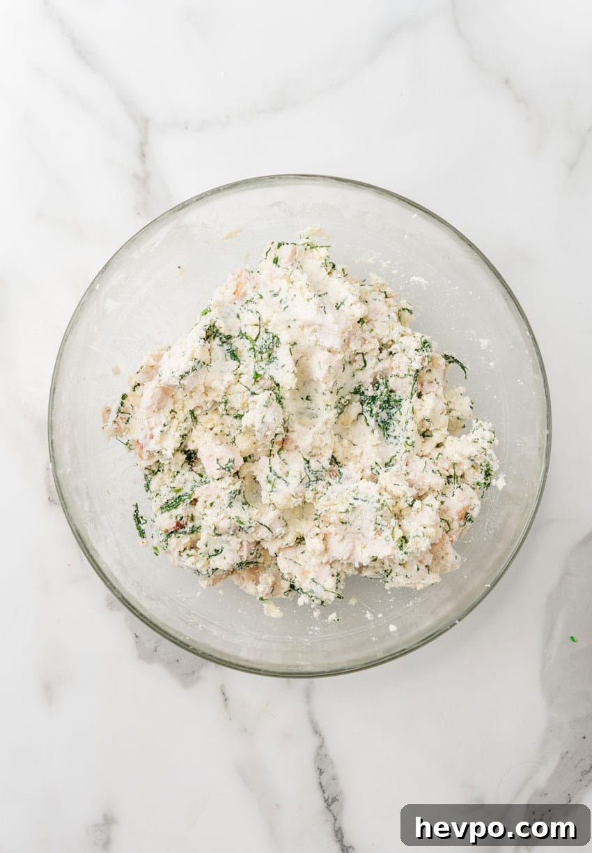 Creamy White Chicken Lasagna Roll-Ups Recipe 6 white chicken lasagna filling in a glass mixing bowl