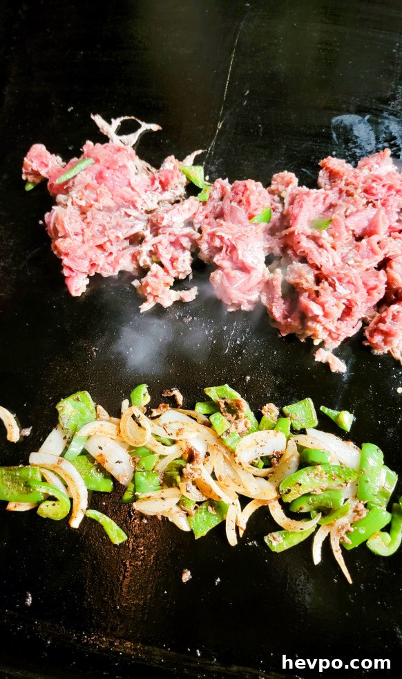 Peppers and onions on griddle