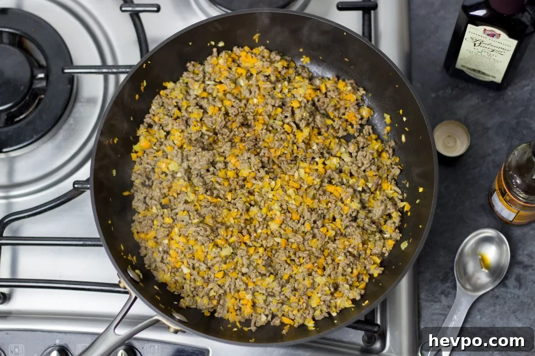 browned beef mince, carrot, onion & garlic in a large saucepan with balsamic vinegar and worcestershire sauce.