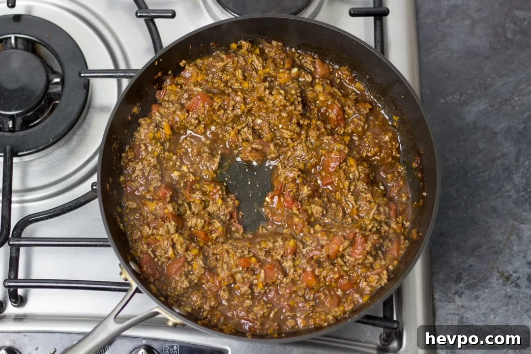 Spaghetti boiling in a pan on the hob