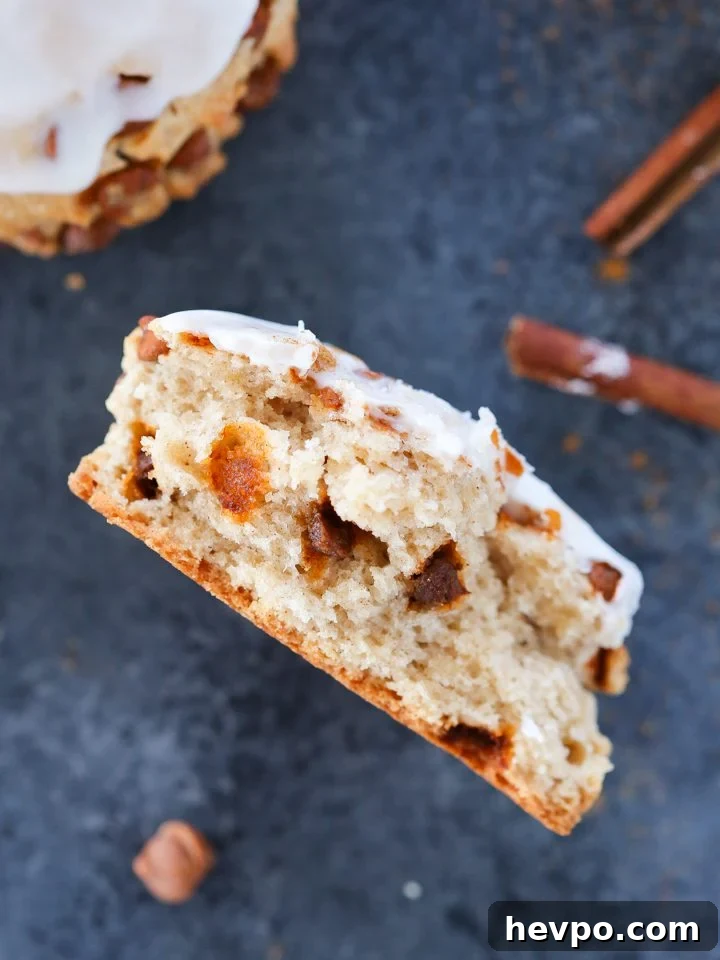 Warm Cinnamon Scones Recipe with Sugar Glaze 2 Cinnamon scone on a blue background.