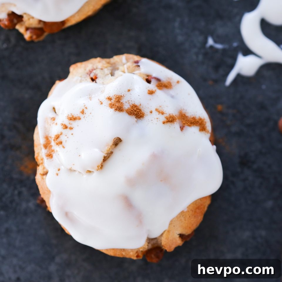 Warm Cinnamon Scones Recipe with Sugar Glaze 5 Cinnamon scone with a cream cheese glaze on top.