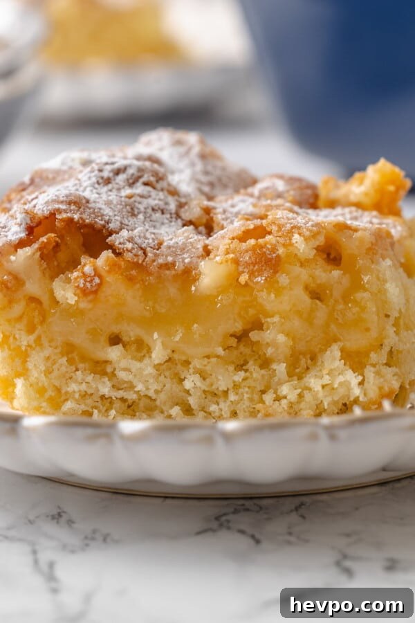 Warm Cinnamon Scones Recipe with Sugar Glaze 6 Center of gooey butter cake shown with buttery filling layered over the yeasted cake base.