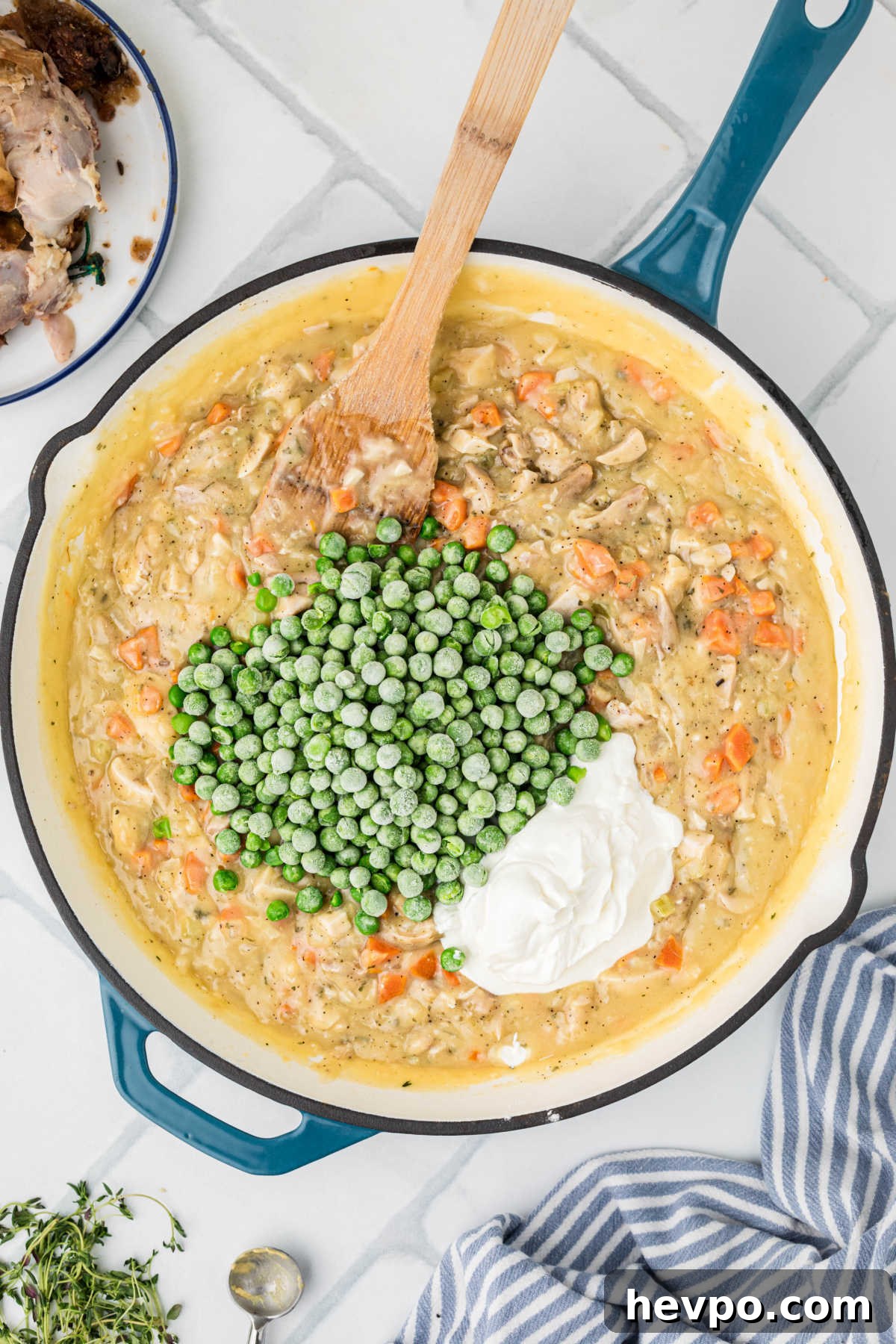 Peas and sour cream added to a chicken pot pie filling.