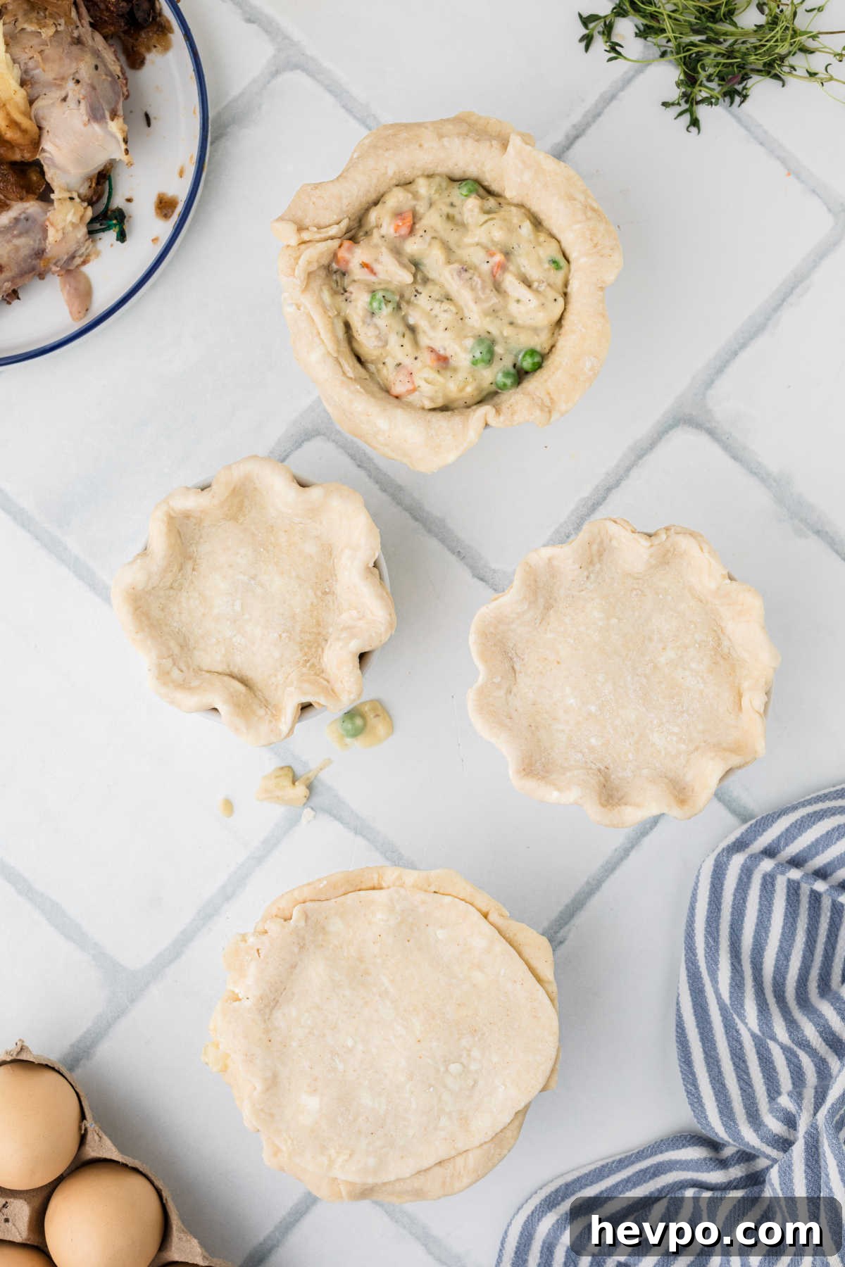 Top crusts added to mini chicken pot pies.