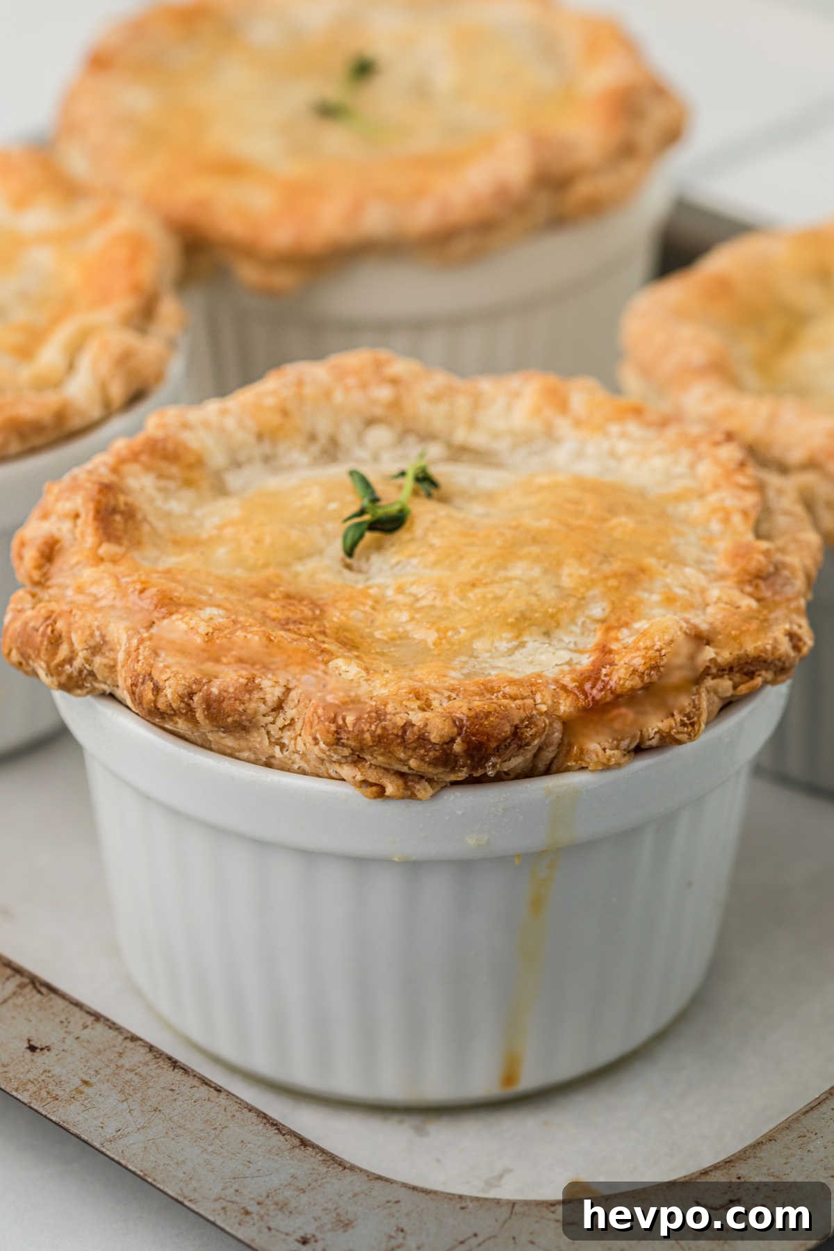Close up of a mini chicken pot pie, made in a ramekin dish.
