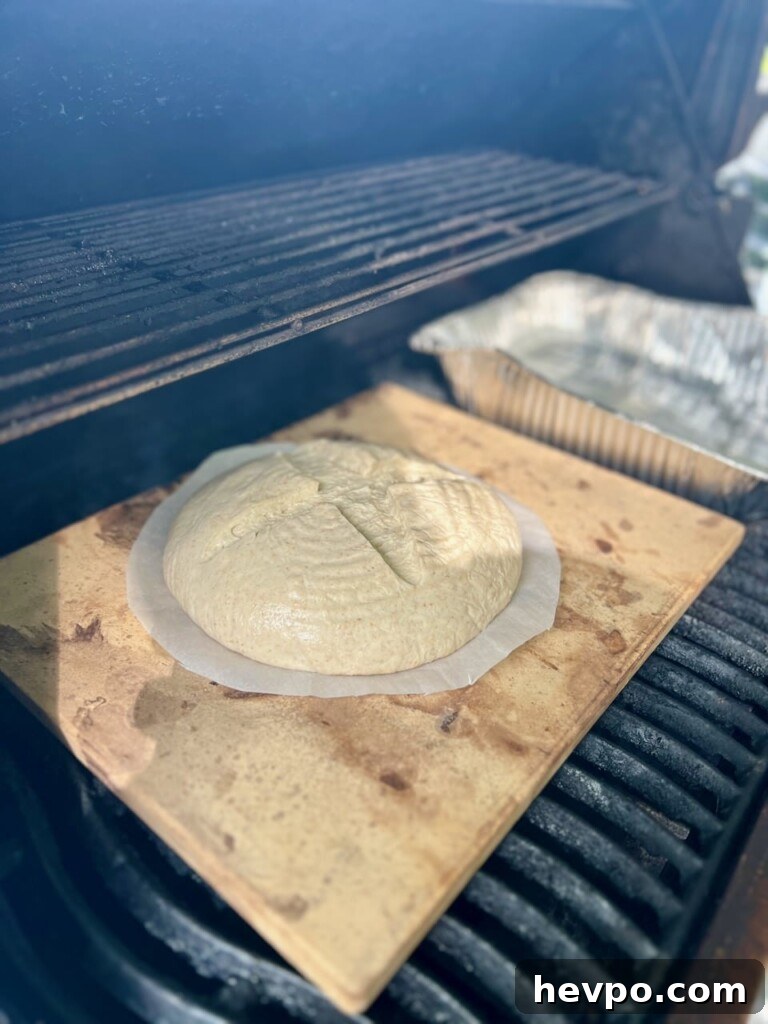 Grilling Sourdough: Step-by-Step Guide to Perfect Crust and Flavor 10 Sourdough on a baking stone inside a grill