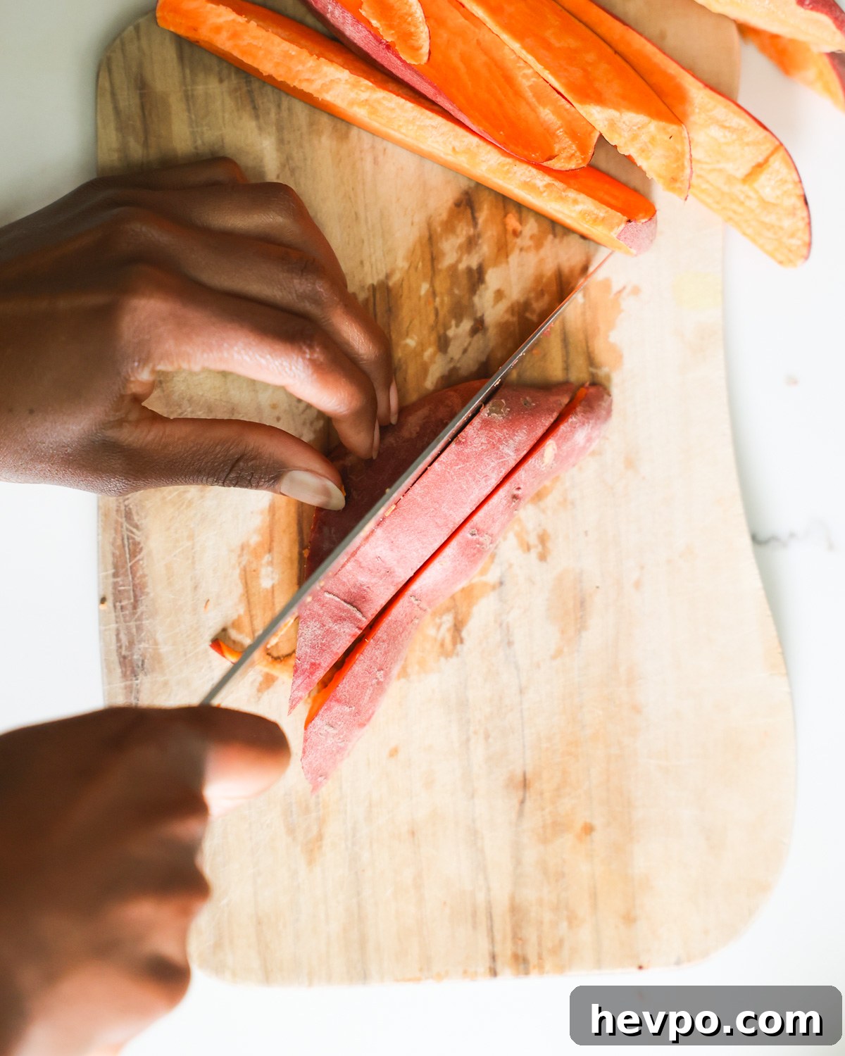 Crispy Air Fryer Sweet Potato Wedges Recipe 4 Cutting sweet potatoes into wedge shape