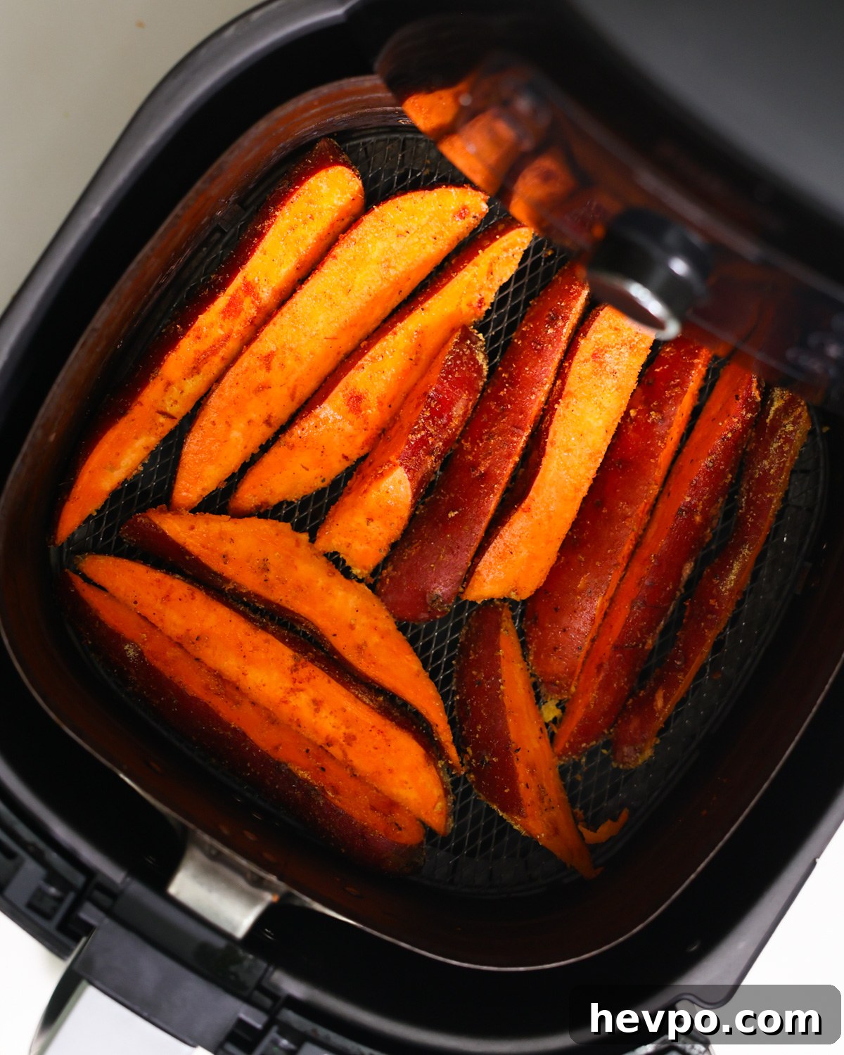 Crispy Air Fryer Sweet Potato Wedges Recipe 6 overhead of sweet potatoes in air fryer