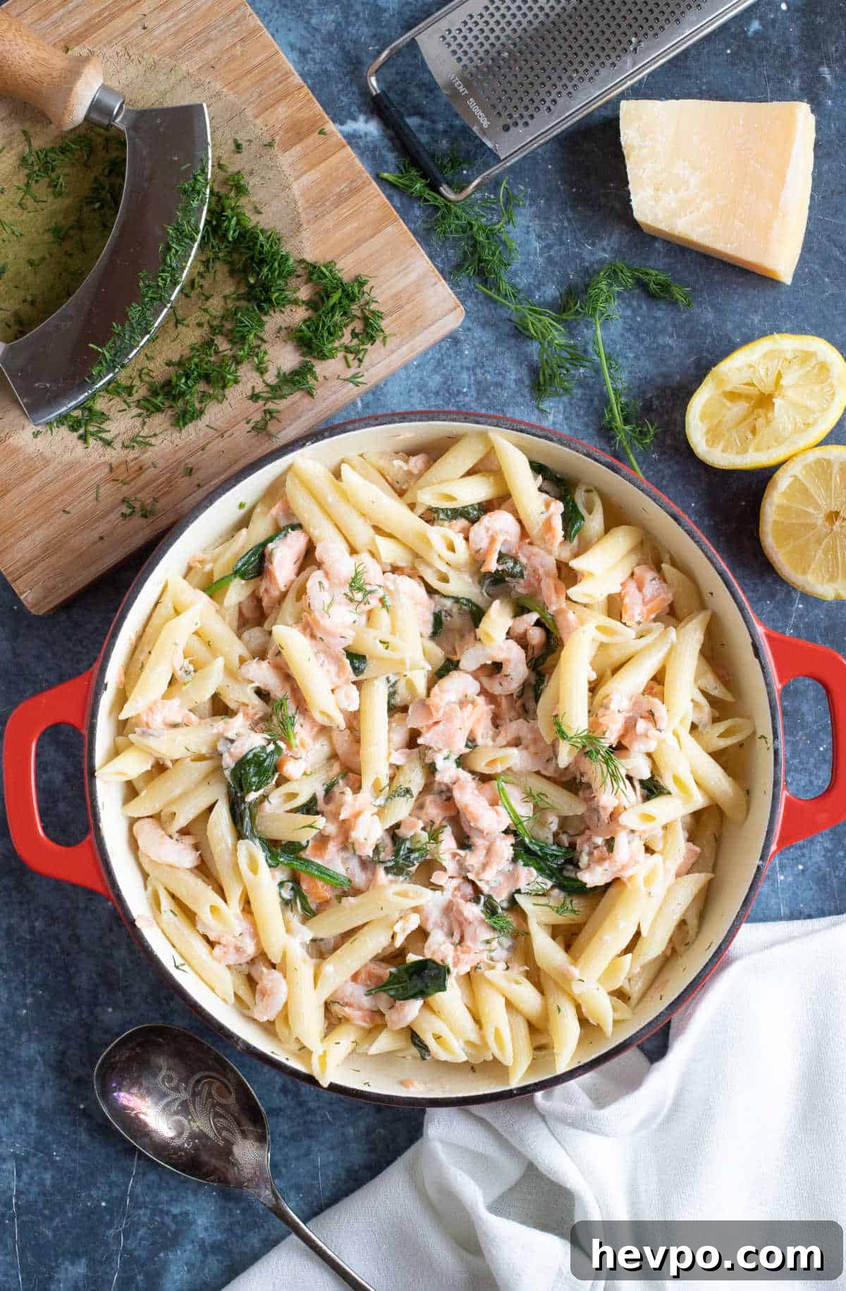 Hot smoked salmon and prawn pasta in a serving dish.