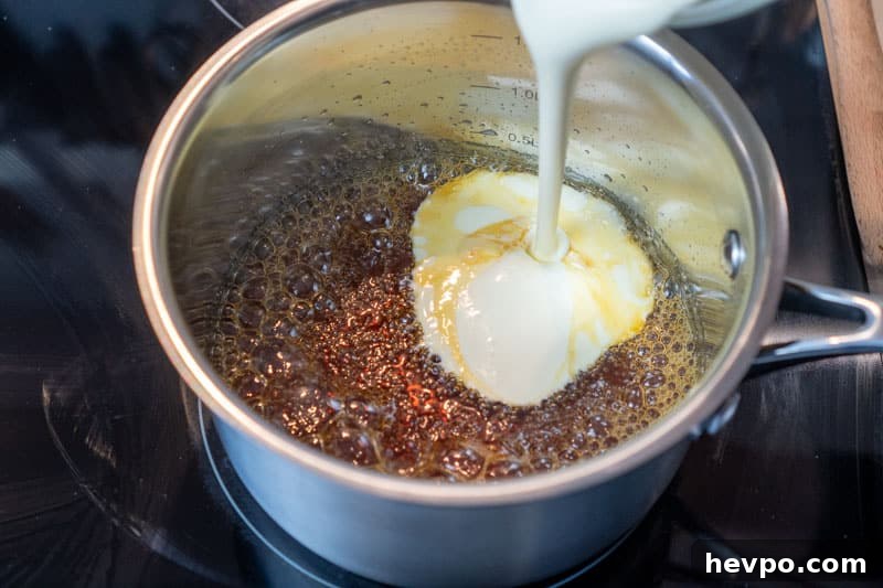 Adding the cream to the pot