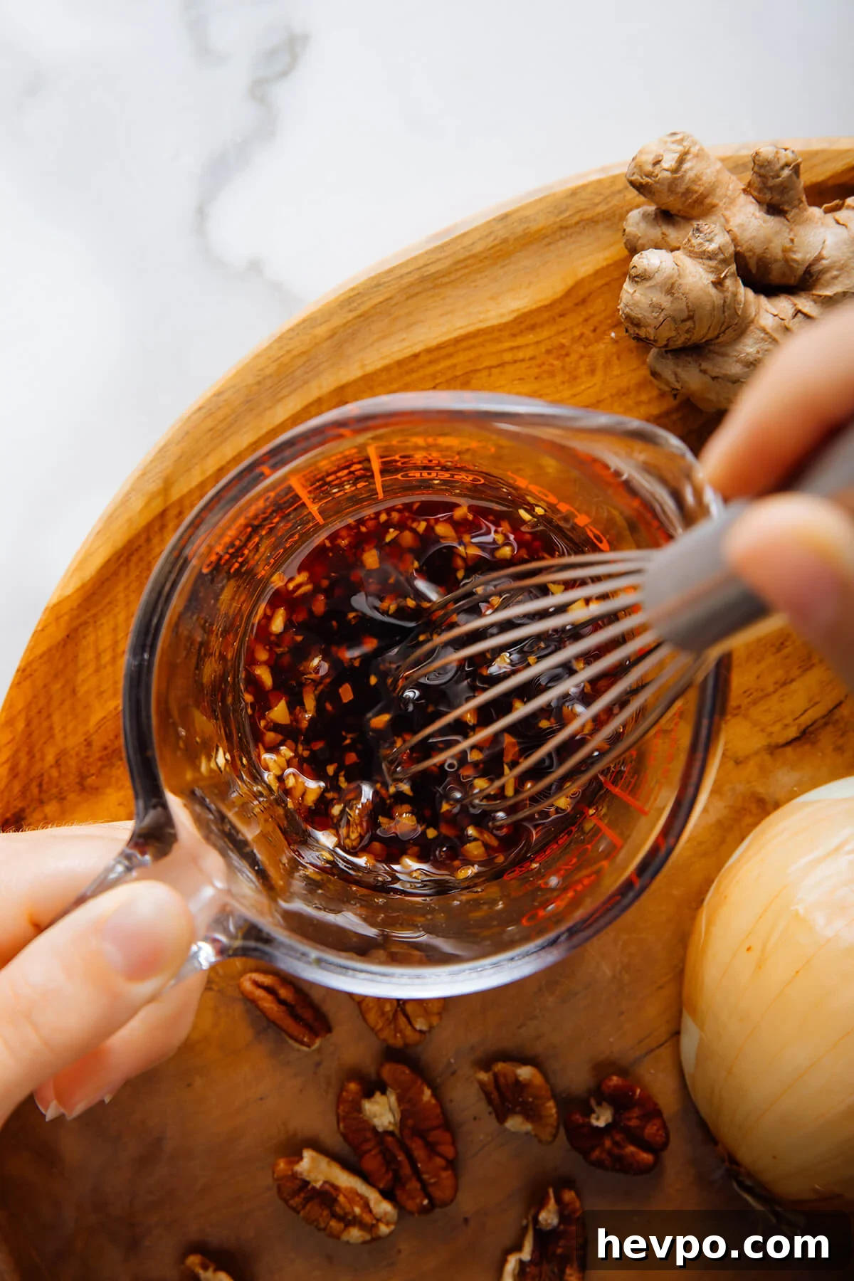 whisking sauce together