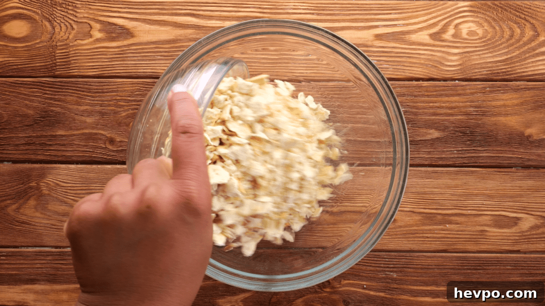 Add saltine crackers to mixing bowl.