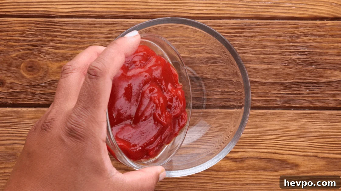 In a separate mixing bowl, add ketchup.