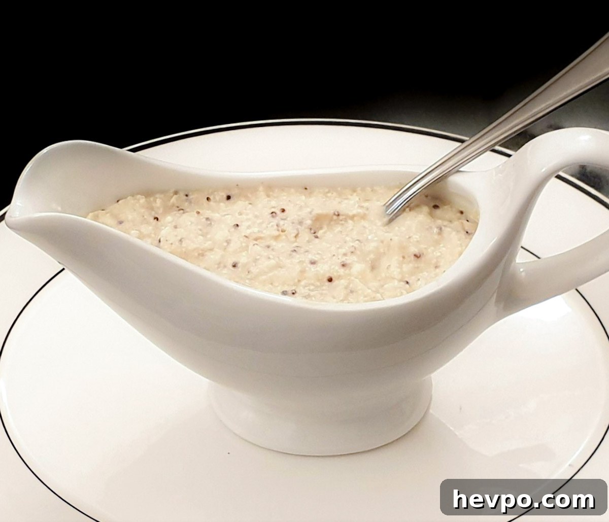 Creamy Honey Mustard Cheese Sauce Recipe 3 A gravy boat filled with honey mustard gravy.