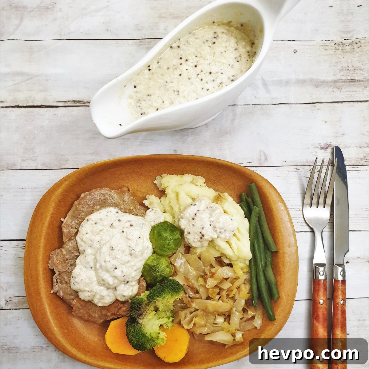 Creamy Honey Mustard Cheese Sauce Recipe 6 Overhead shop of honey mustard gravy in a gravy boat, along side a plate of food.
