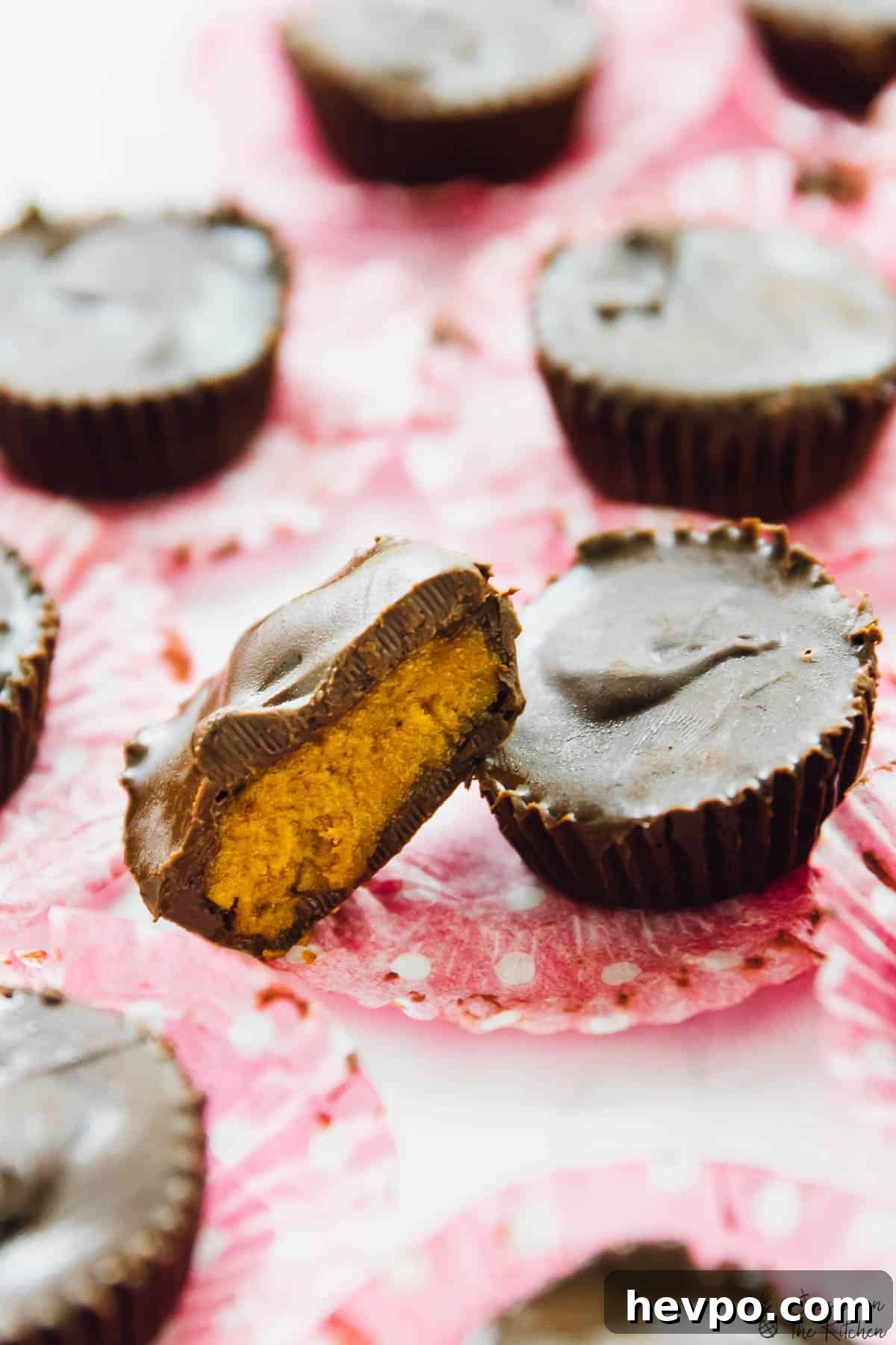 Chocolate cups cut in half on paper muffin liners.